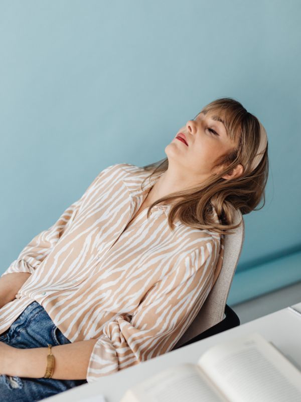 Tired man unable to sleep due to sleep apnea