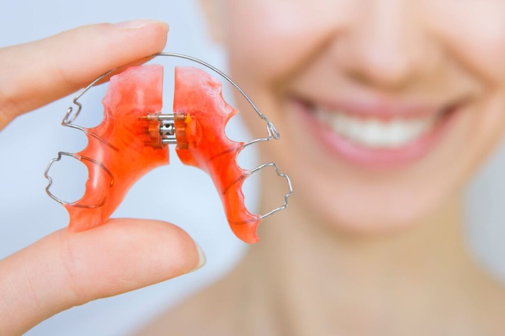 A woman holding a retainer.